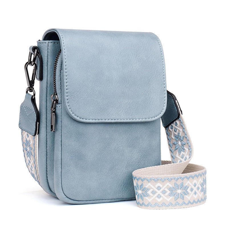 Small crossbody bag with decorative shoulder strap Stornfield