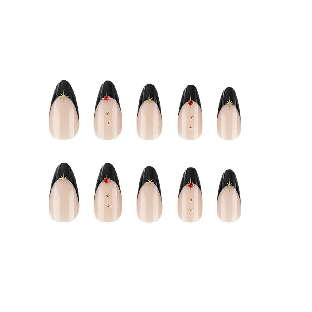 Glamorous artificial nails in stylish stiletto design with golden accents Stornfield