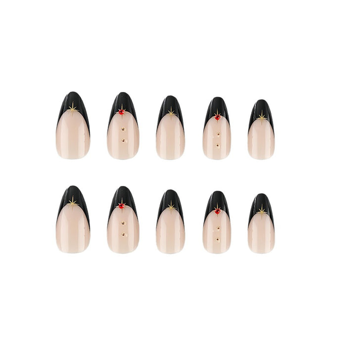 Glamorous artificial nails in stylish stiletto design with golden accents Stornfield