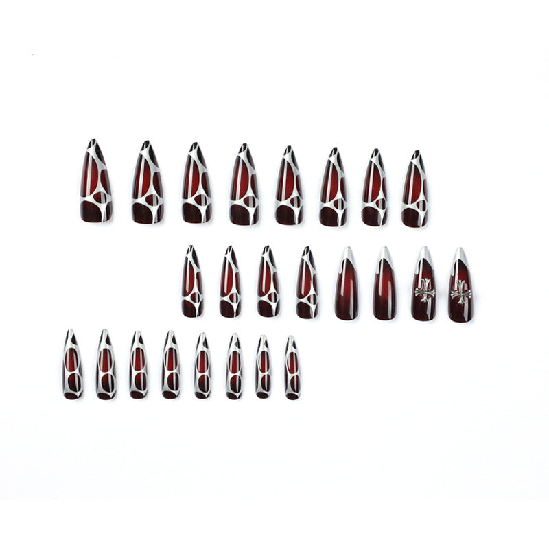 Artful Stiletto Nails with Elegant Cross Decoration Stornfield