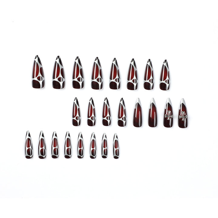 Artful Stiletto Nails with Elegant Cross Decoration Stornfield