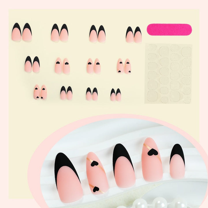 Creative nail art set with heart-shaped accents and elegant French tips Stornfield