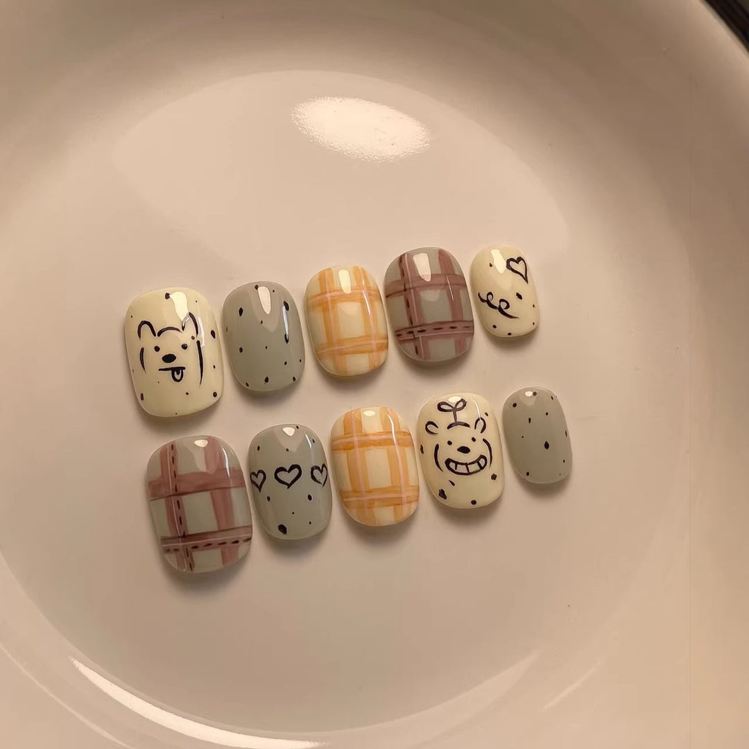 Playful Cartoon-Character Press-On Nail Art Collection