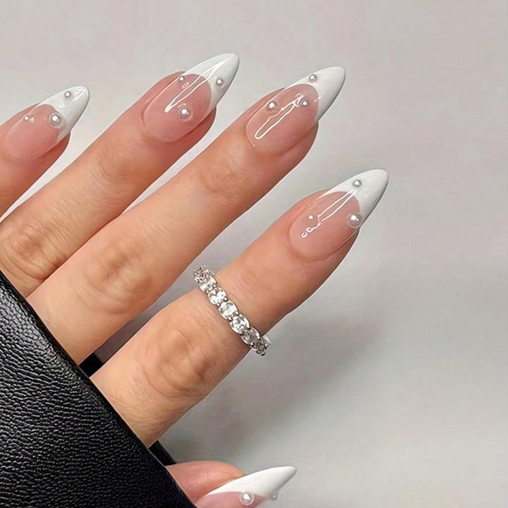 Artificial nail set with elegant French tip and shimmering pearl accents Stornfield