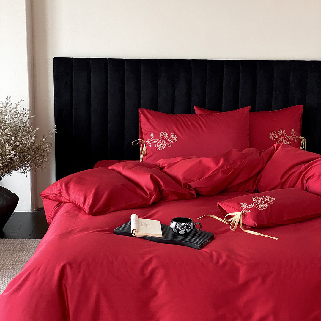 Premium cotton satin bedding set with botanical embroidery and decorative cushion ties