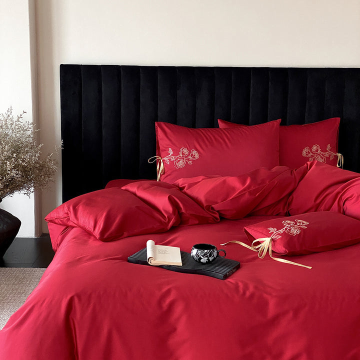 Premium cotton satin bedding set with botanical embroidery and decorative cushion ties