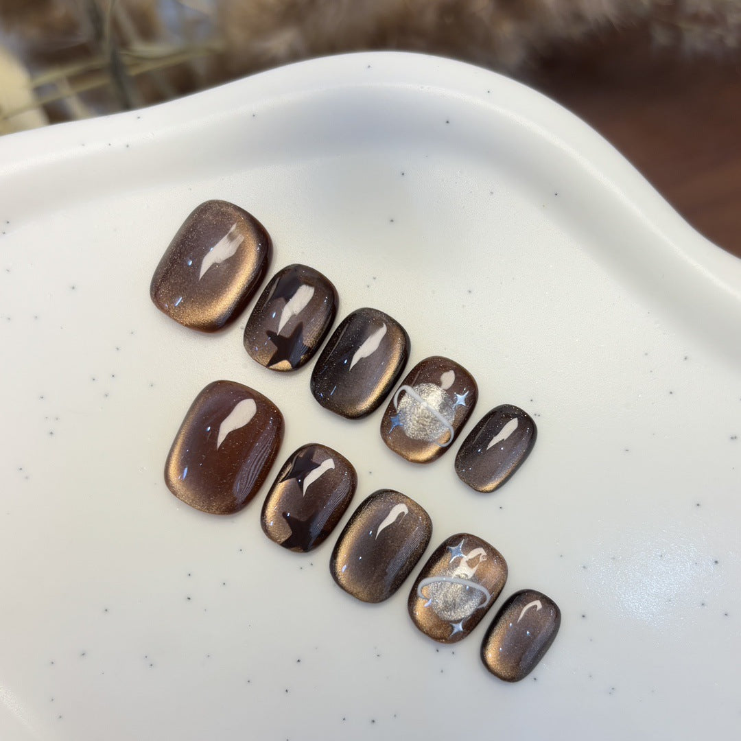 Artificial nail set with star and planet design Stornfield