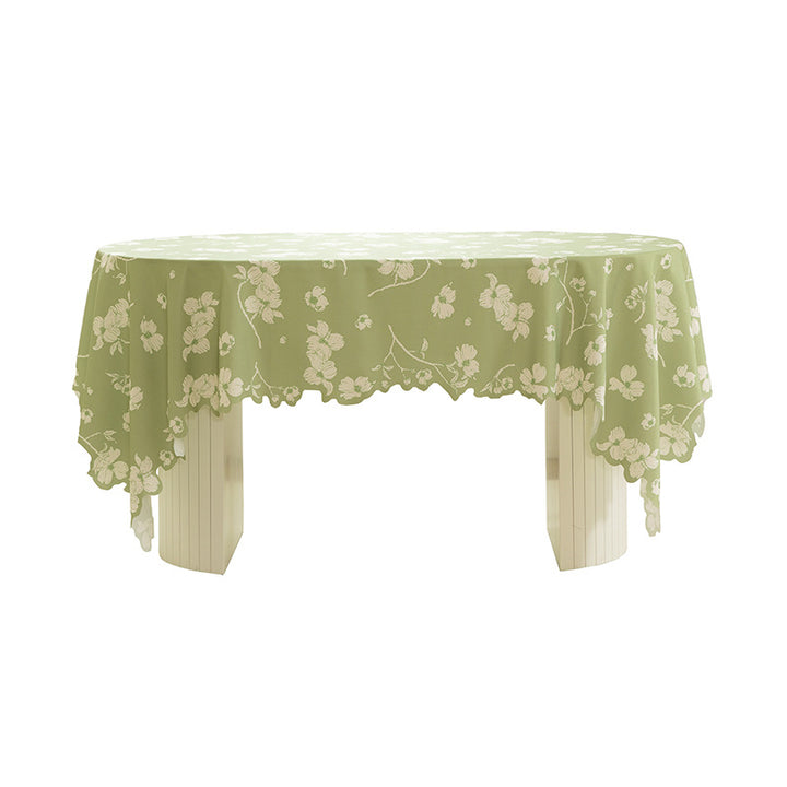 Round wipeable tablecloth with floral cut-out hem Stornfield