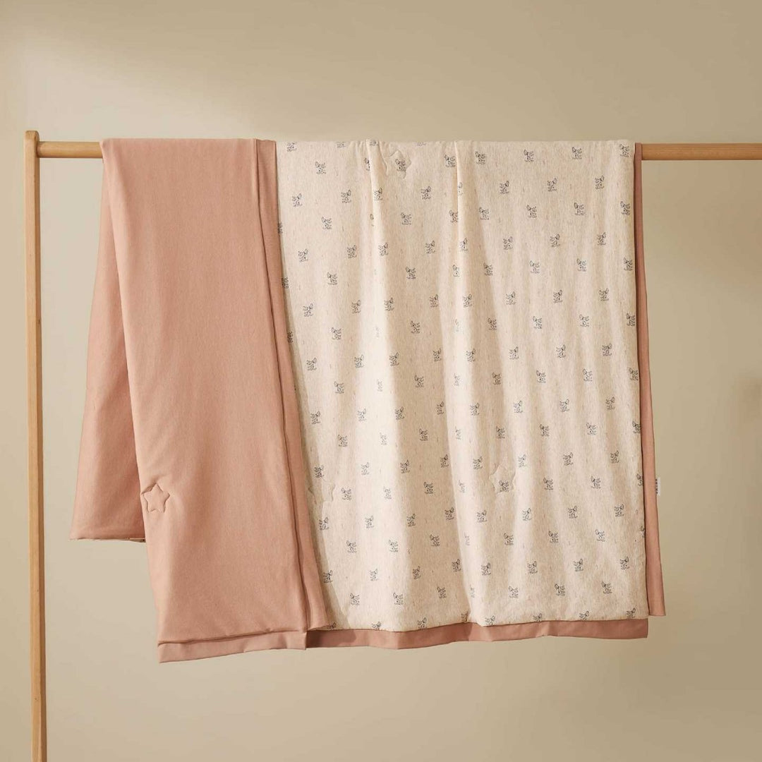 Double-layer baby crawling blanket made of cotton jersey with light padding and delicate all-over animal print