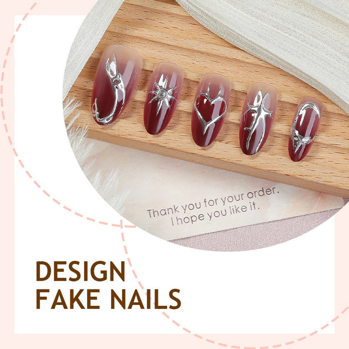 Artificial nail set with elegant glitter accents and floral details Stornfield