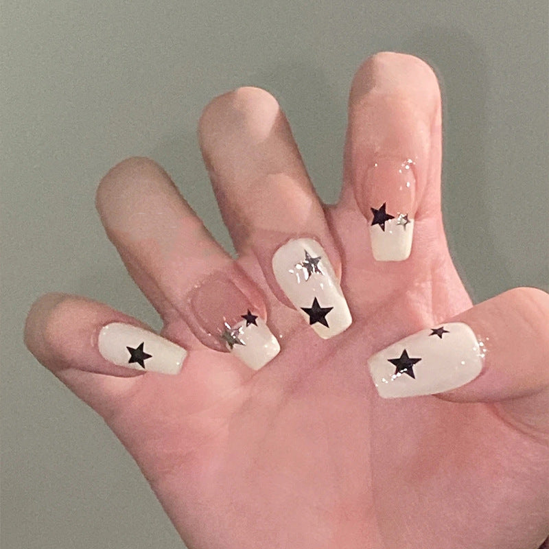 Artificial nail set with glamorous star design and sparkling accents Stornfield