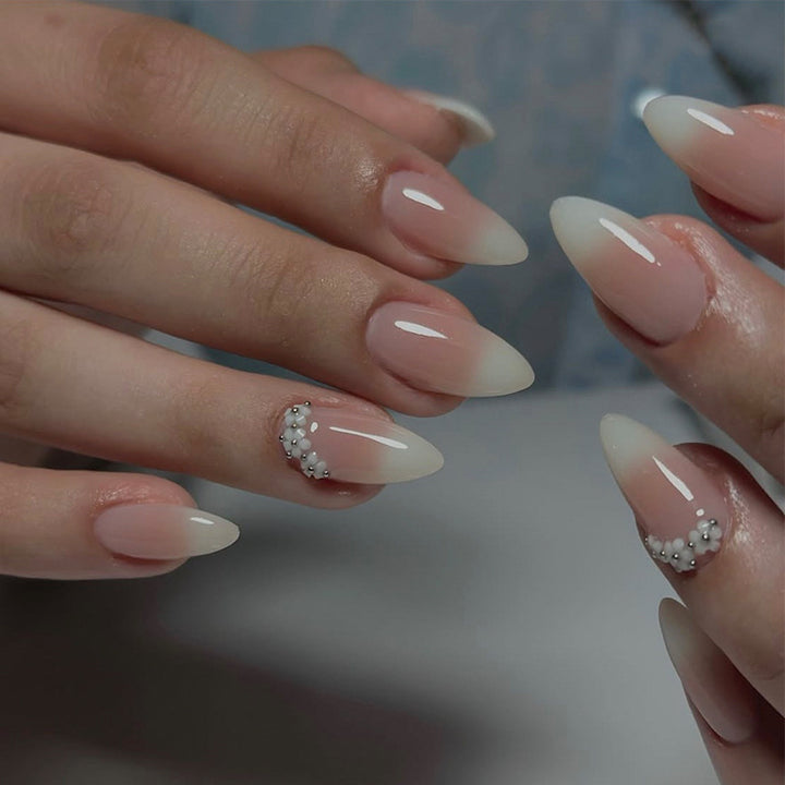 Acrylic nail set with elegant French tip and extravagant decorative details Stornfield
