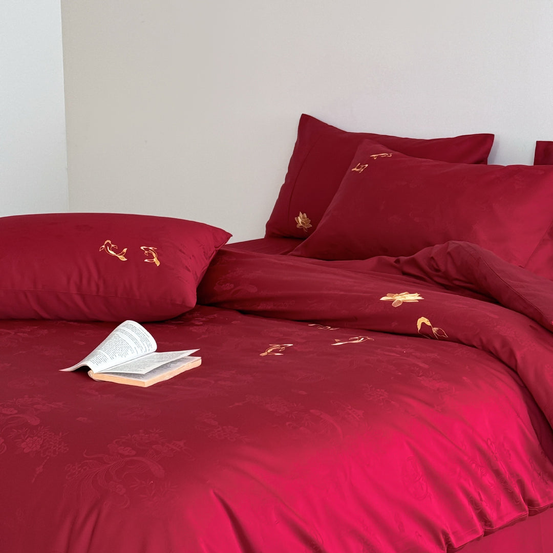 Luxurious bed linen set made of cotton satin with embroidered koi motifs and fine jacquard structure