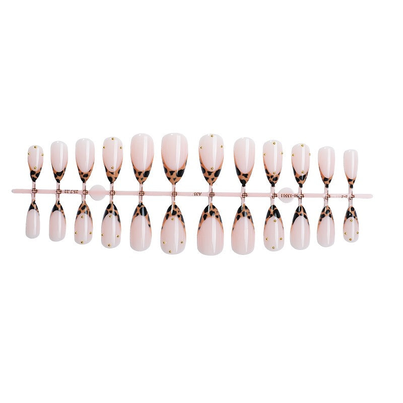 Acrylic nail set with elegant leopard design and gold accents Stornfield