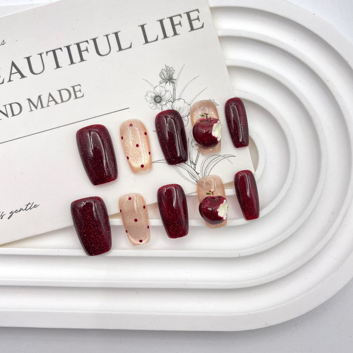 Artistic Press-On Nail Art Set with Creative Apple and Polka Dot Designs