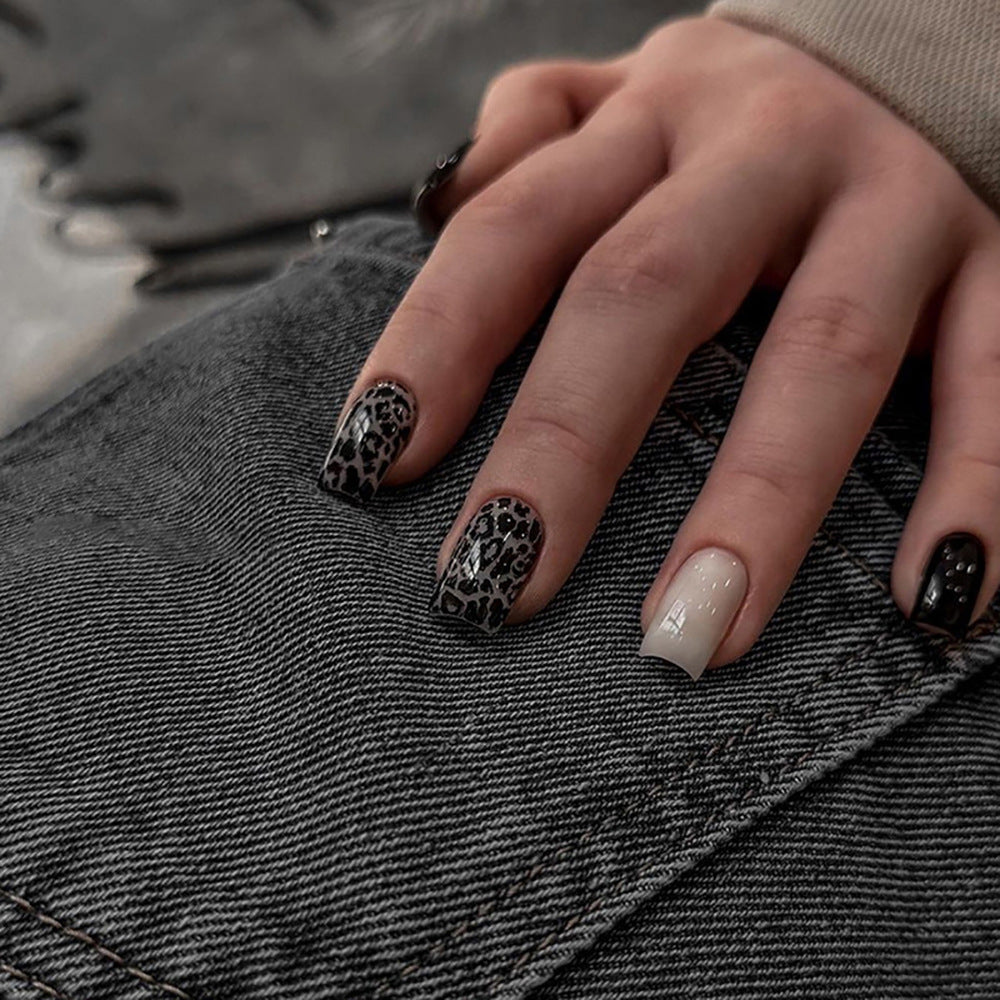 Acrylic nail set with stylish leopard pattern and elegant accents Stornfield