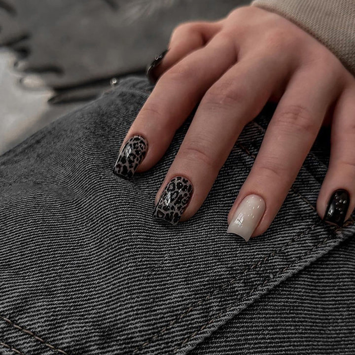 Acrylic nail set with stylish leopard pattern and elegant accents Stornfield