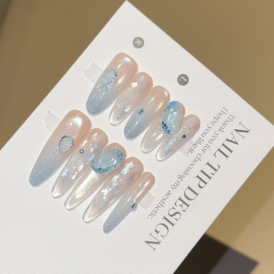 Artificial nails with rhinestones and glitter effects Stornfield