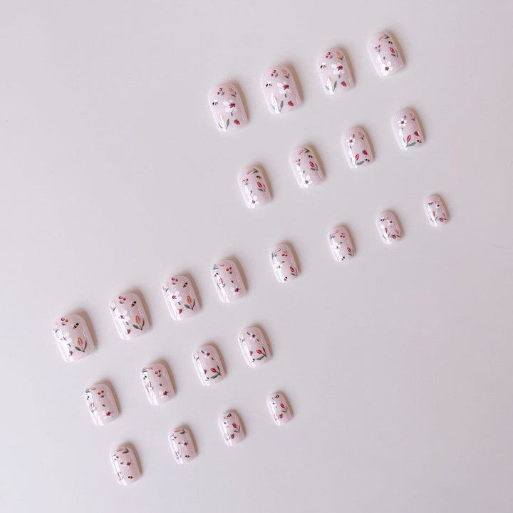 Artificial nail set with cheerful flower and bee designs Stornfield