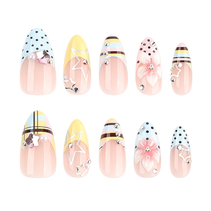 Creative nail designs with floral accents and glitter Stornfield