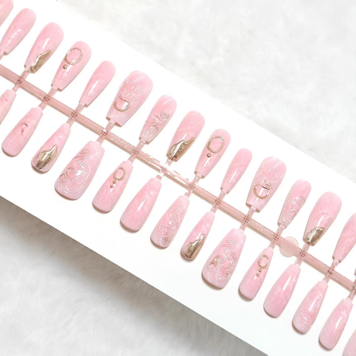 Artificial nails with elegant gold embellishments Stornfield