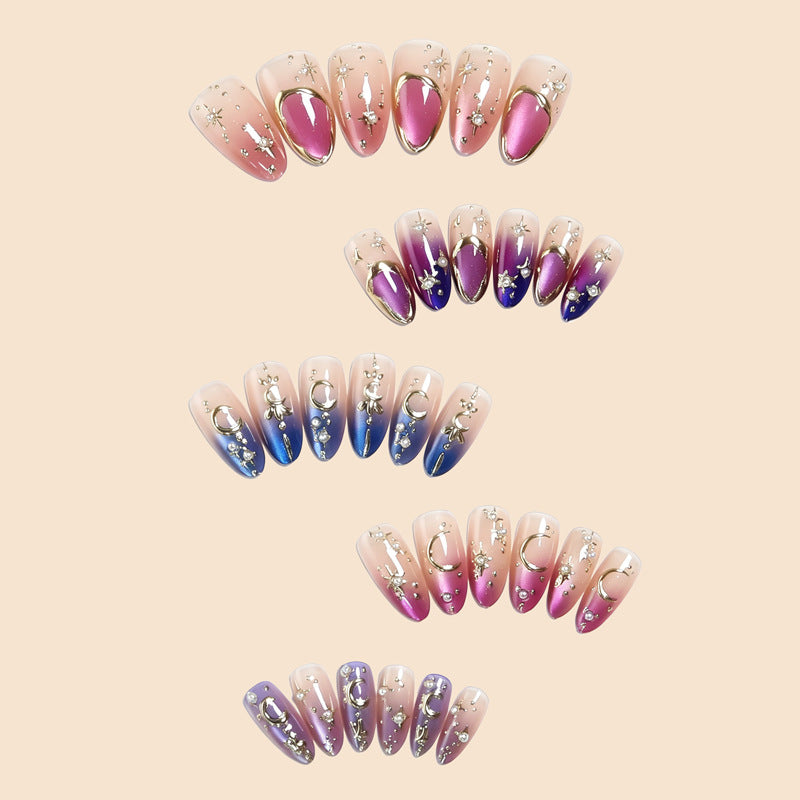 Glamorous artificial nails with star and moon motifs Stornfield