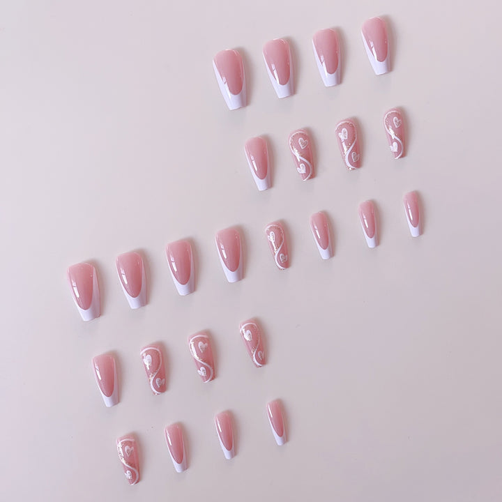 Artificial nail set with elegant heart decorations and glitter accents Stornfield