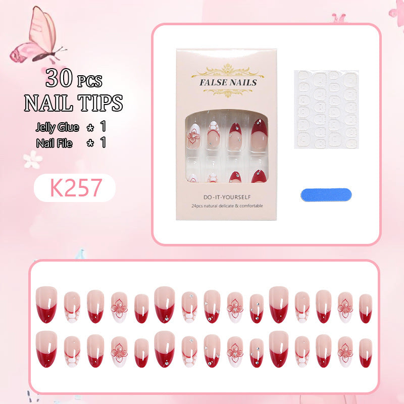 Artificial nails with floral and glittering accents Stornfield