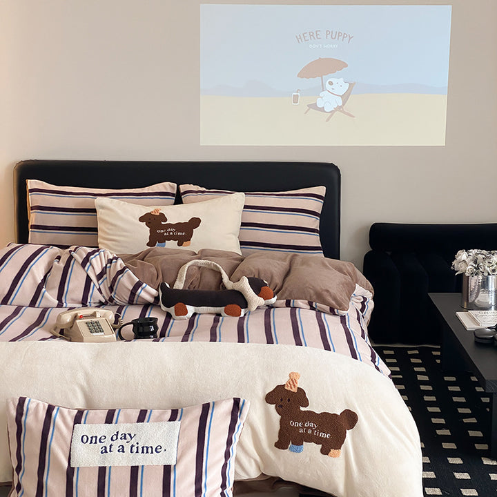 Cotton bedding set with striped look, embroidery motif and plush application