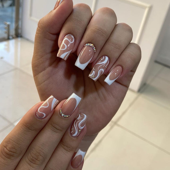 Artificial nail set with elegant French design and creative accents Stornfield