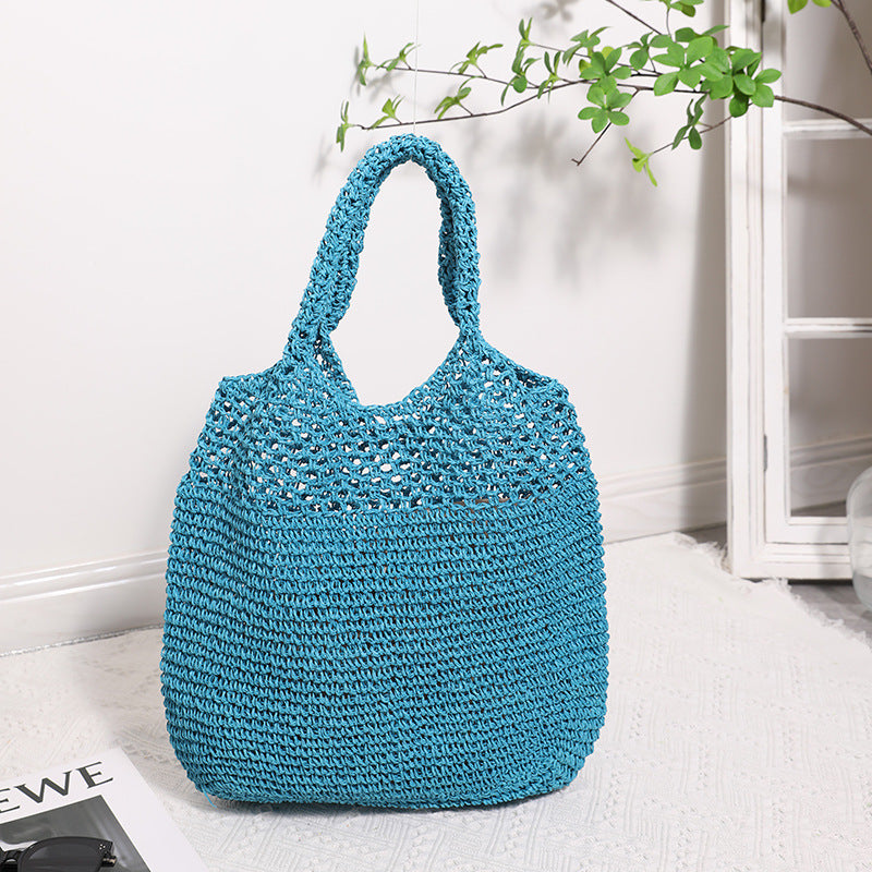 Handcrafted straw bag with wide carrying handle Stornfield