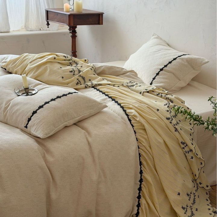 Bedding set with gathered bed skirt, embroidered trim and cotton-linen mix