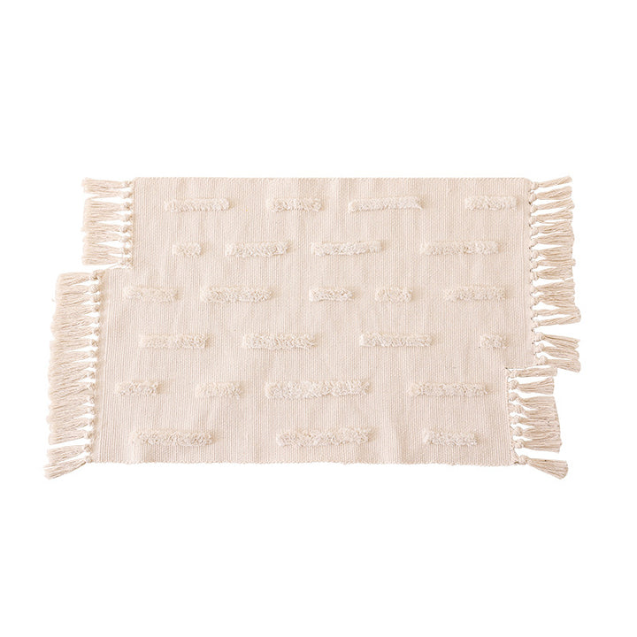 handwoven cotton runner with fringe and embossed relief pattern