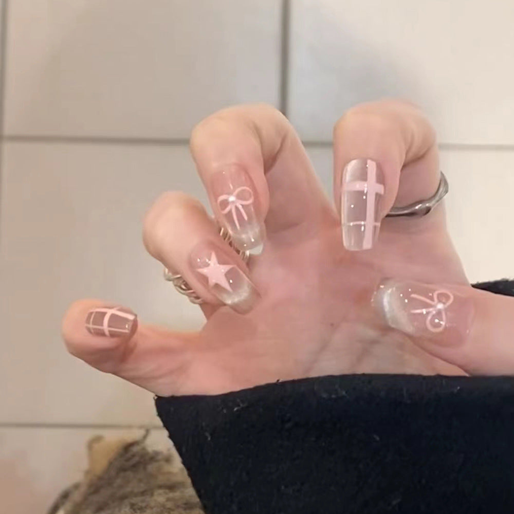Artistic acrylic nails with elegant bow and star designs Stornfield