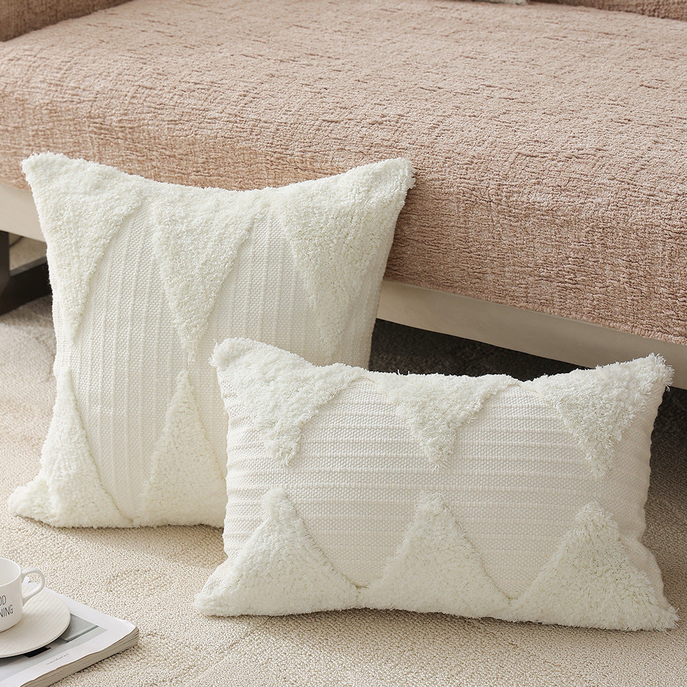 Square decorative pillow with tufted triangle structure and bouclé surface