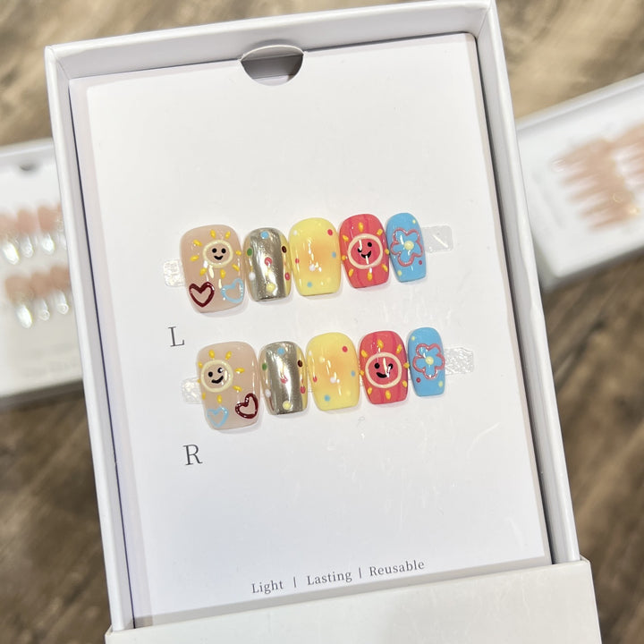 Whimsical Press-On Nail Art Set with Smiley Faces and Floral Designs Stornfield