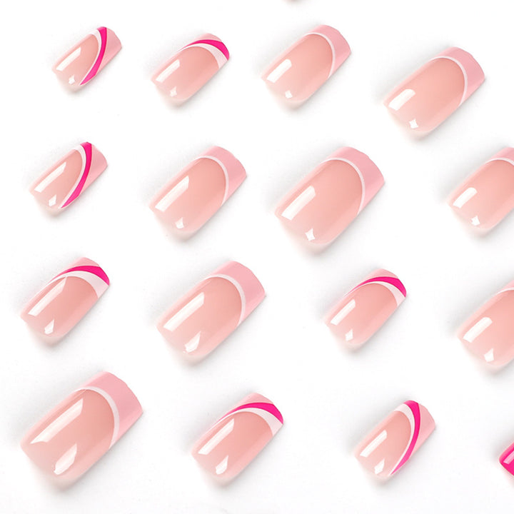 Acrylic nail extensions with elegant gradient and curved accents Stornfield