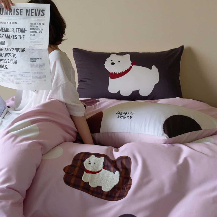 Cotton satin bedding with embroidered dog motif and red cord
