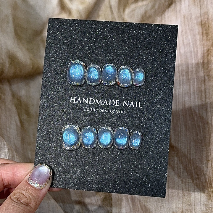 Handmade art nails with shimmering effects Stornfield