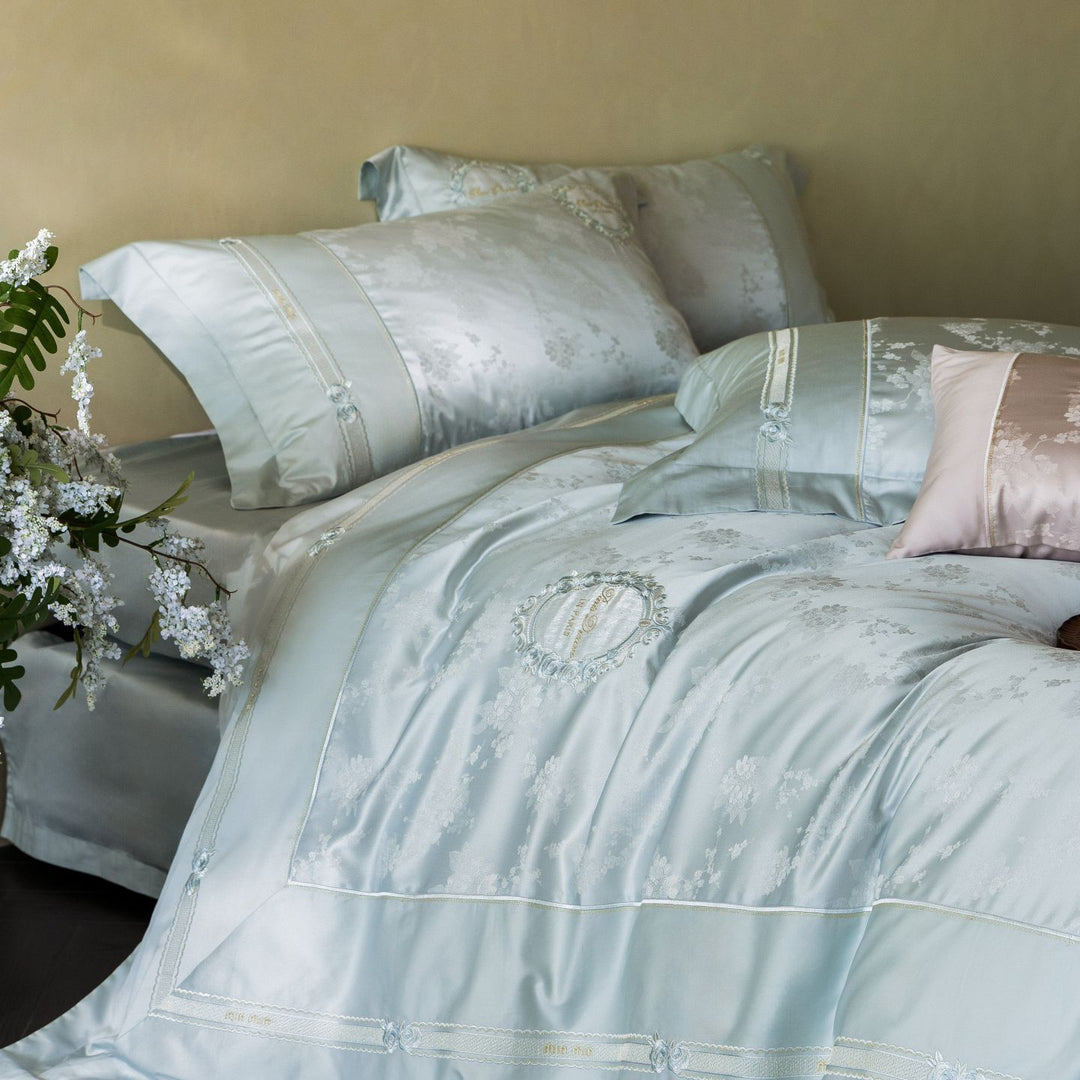 Luxurious satin bedding set with embroidered medallions and elegant quilting