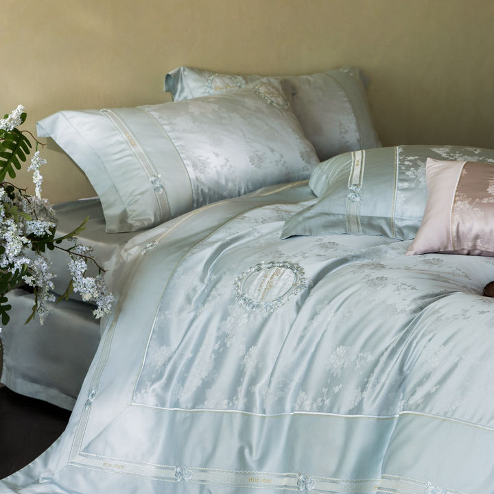 Luxurious satin bedding set with embroidered medallions and elegant quilting