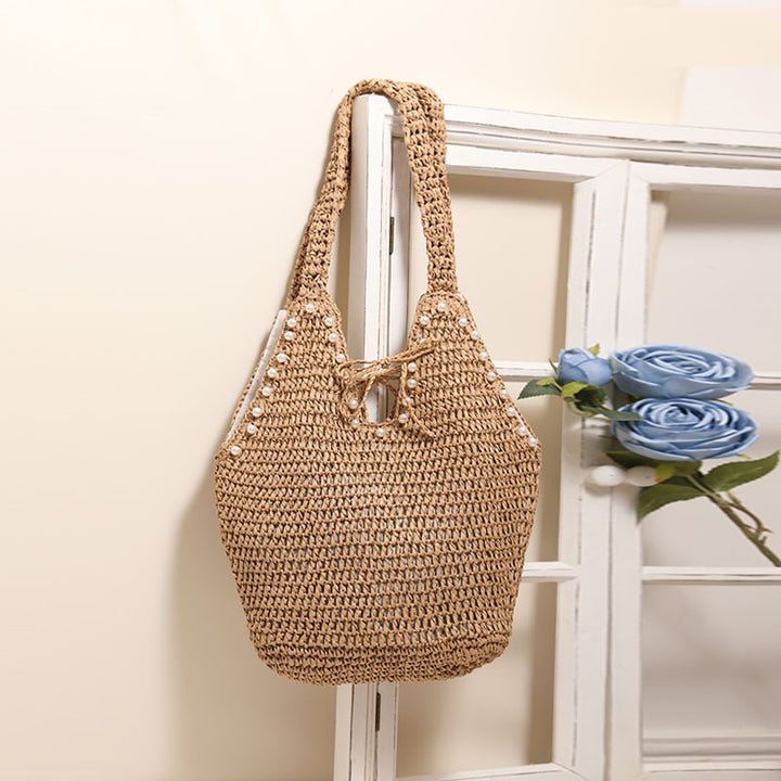 Handbag with pearl decor and innovative closure Stornfield