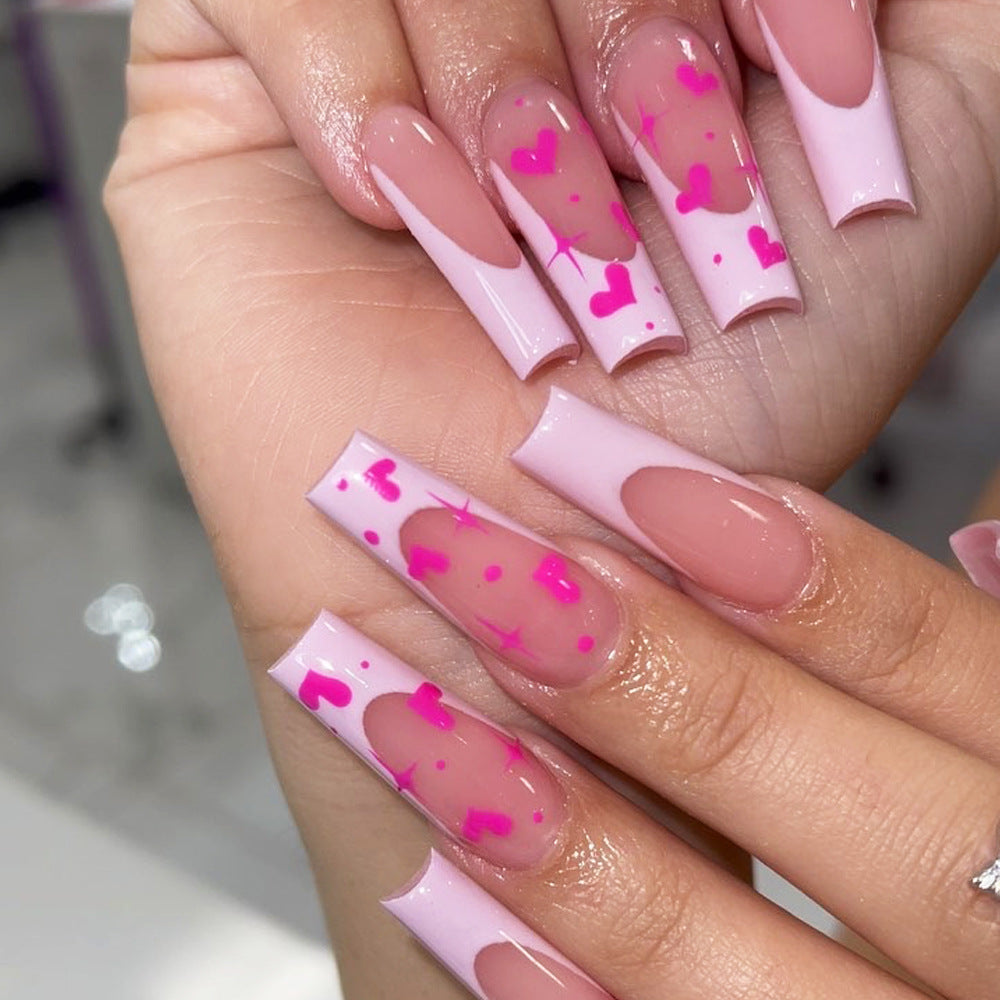 Artful Nail Extensions with Heart-Shaped Accents Stornfield