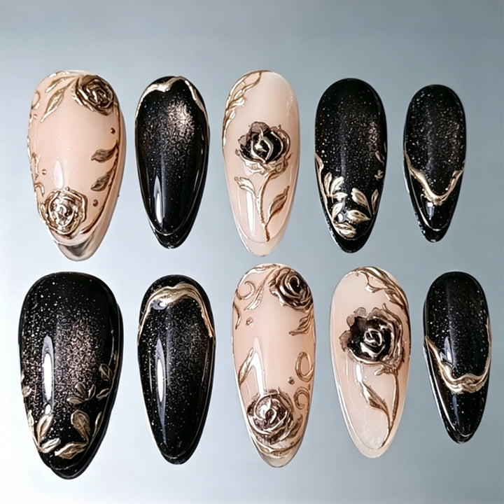 Nail set with elegant gold embellishments and original patterns Stornfield