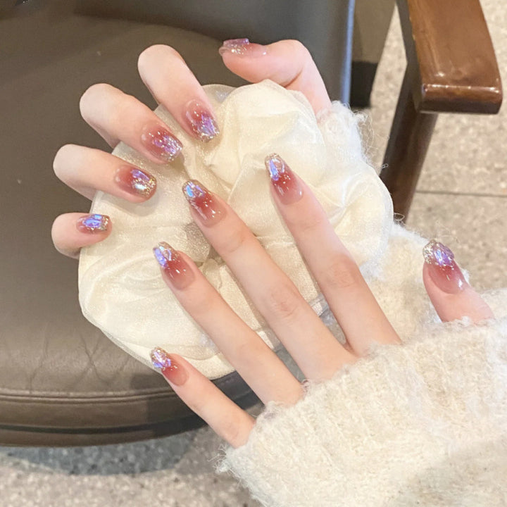 Glamorous artificial nails with glitter effects Stornfield