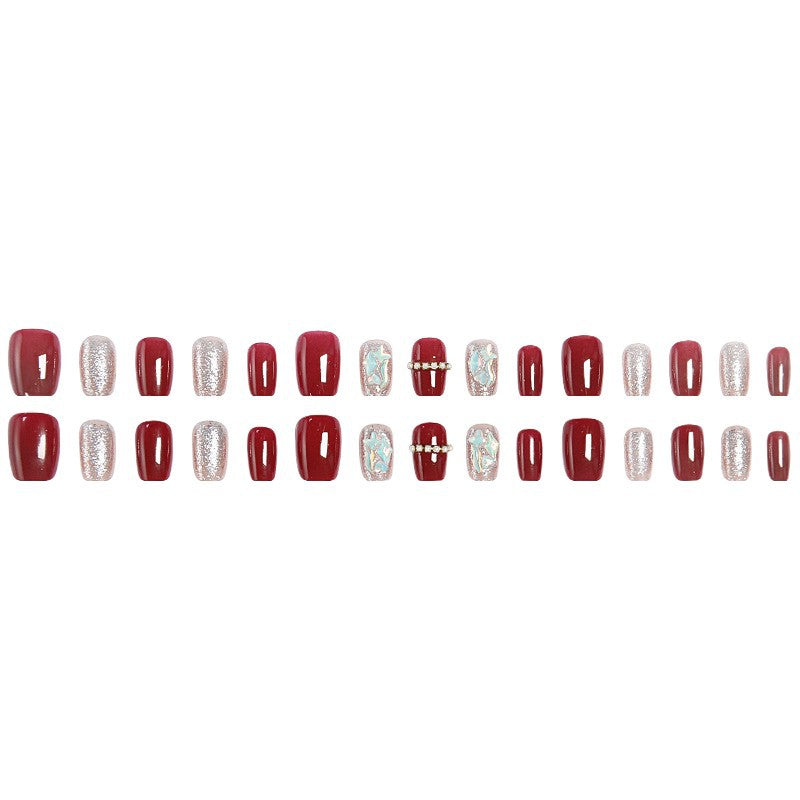 Glamorous artificial nail set with sparkling 3D applications and elegant embellishments Stornfield