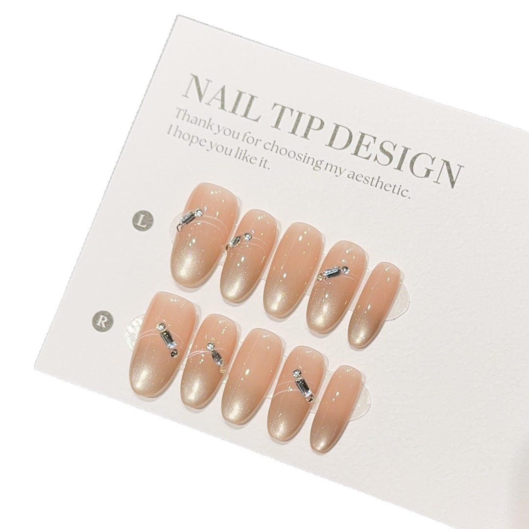 Artificial nail tips with elegant gradient color and rhinestone accents Stornfield