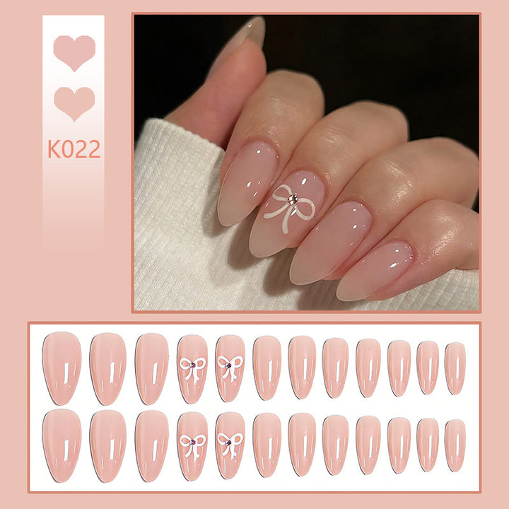 Artificia nails with delicate bow accents Stornfield