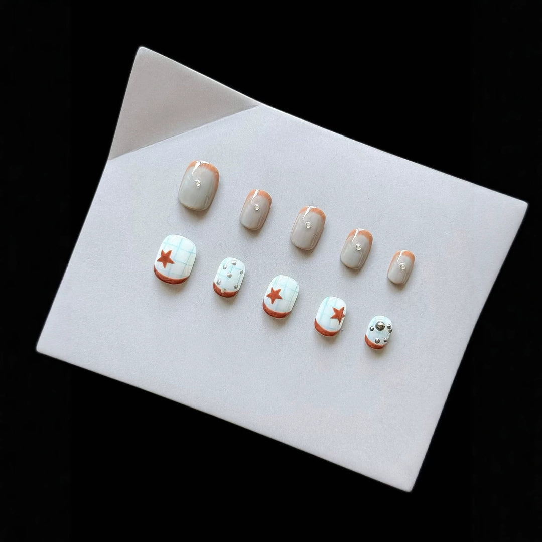 Artistic Press-On Nail Art Set with Star and Metallic Accents