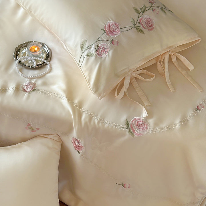 Satin bedding set with embroidered rose vines and shaped butterfly decorative pillow